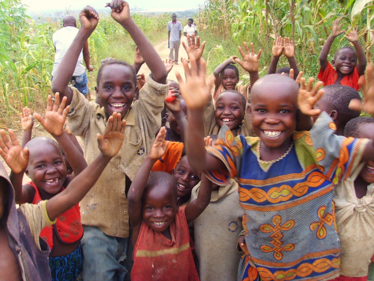 Children and community members participating in a positive community activity